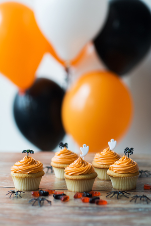 halloween party cupcakes or muffins on tableの写真素材
