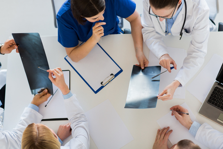 doctors with spine x-rays and clipboardsの写真素材