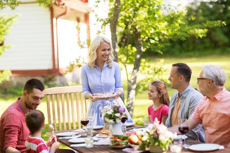 happy family having dinner or summer garden partyの写真素材