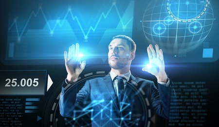 businessman working with charts on virtual screenの写真素材