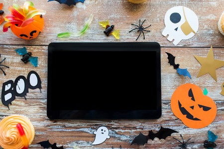 tablet pc, halloween party decorations and treatsの写真素材