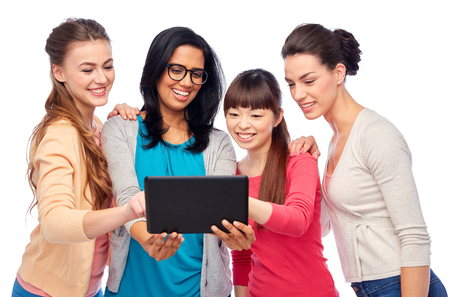 international group of happy women with tablet pcの写真素材