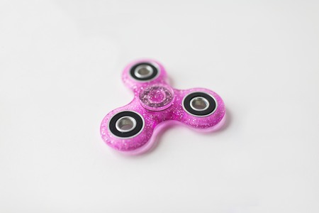 pink glittered fidget spinnerの写真素材