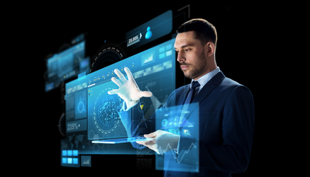 businessman with tablet pc and virtual screenの写真素材