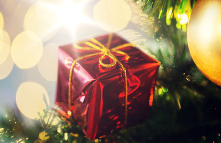 close up of gift box decoration on christmas treeの写真素材