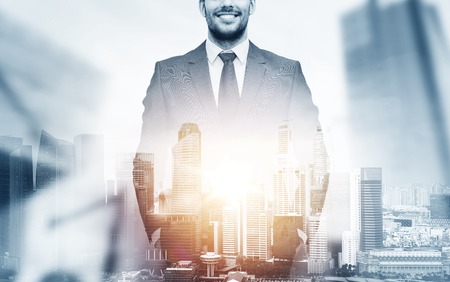 close up of happy businessman over city backgroundの写真素材