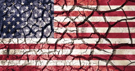 american flag on cracked ground backgroundの写真素材