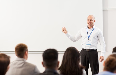 group of people at business conference or lecture