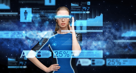 woman in virtual reality 3d glasses with chartsの写真素材
