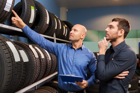 customer and salesman at car service or auto storeの写真素材