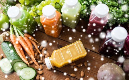 bottles with different fruit or vegetable juicesの写真素材