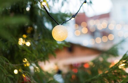 close up of christmas tree garland bulb outdoors