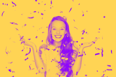 happy young woman or teen girl in fancy dressの写真素材