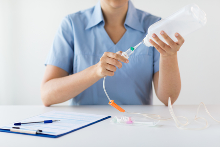 close up of nurse preparing drop counterの写真素材