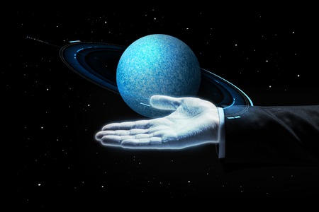 close up of businessman with planet hologramの写真素材