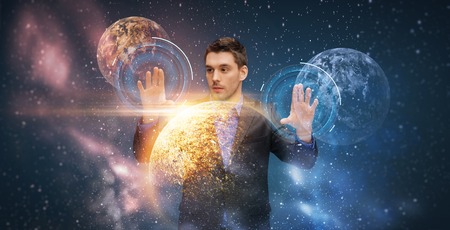 businessman with virtual planets and spaceの写真素材