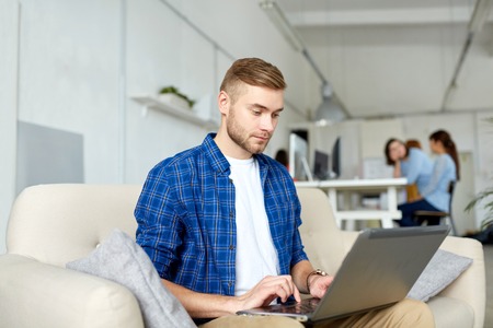 man with laptop working at office