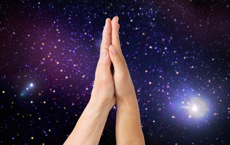 close up of senior and young woman touching hands