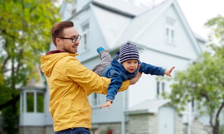 father with son playing and having fun outdoorsの写真素材