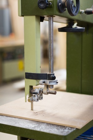 jig saw machine sawing board at workshopの写真素材
