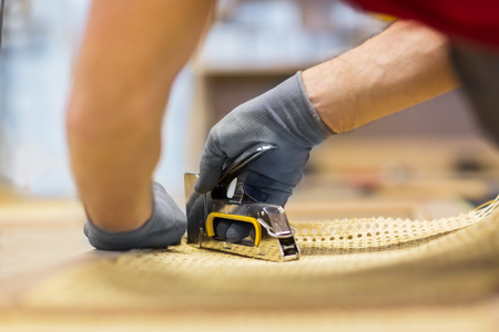 assembler with staple gun making furnitureの写真素材