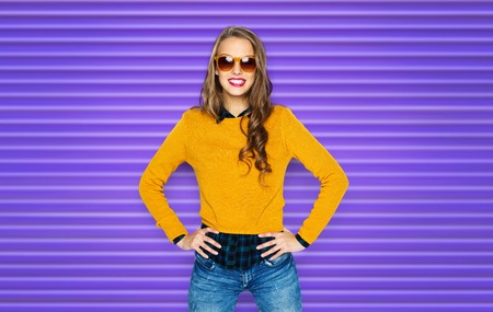 happy young woman or teen girl in casual clothesの写真素材