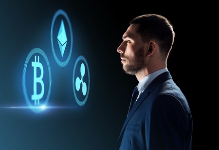 buisnessman looking at cryptocurrency icons