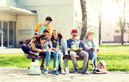 group of students with notebooks at school yardの写真素材