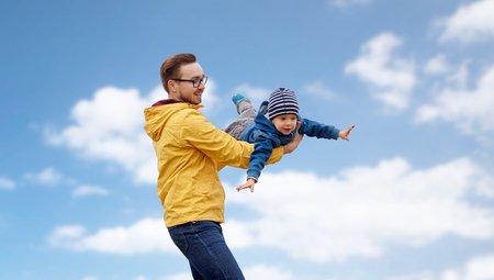 father with son playing and having fun outdoorsの写真素材