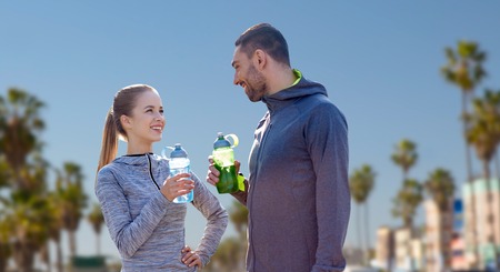 couple of sportsmen with water over venice beachの写真素材