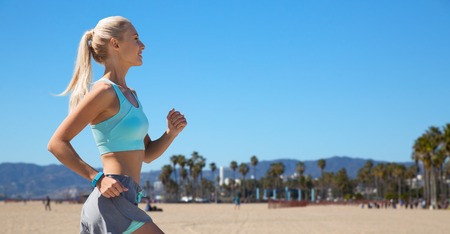woman with fitness tracker runningの写真素材