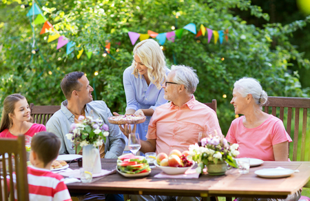 happy family having dinner or summer garden partyの写真素材
