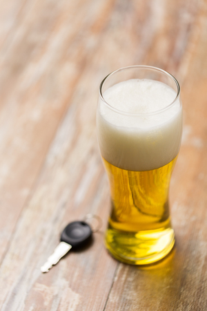 close up of alcohol and car key on tableの写真素材