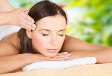 close up of beautiful woman having head massageの写真素材