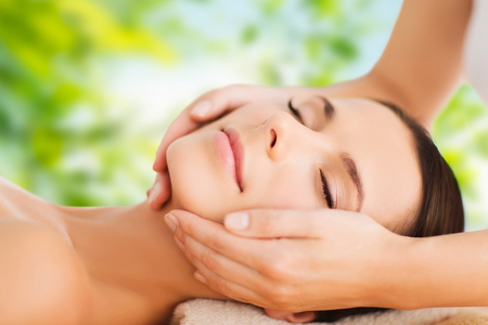close up of beautiful woman having face massageの写真素材