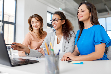 businesswomen with laptop working at officeの写真素材