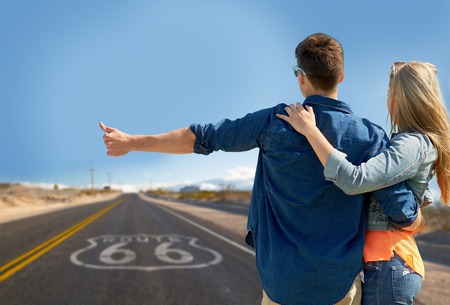 couple hitchhiking over us route 66 in americaの写真素材
