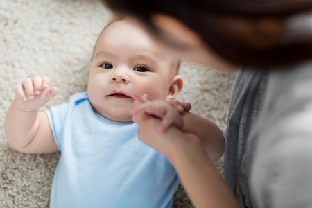 close up of sweet little asian baby boy and motherの写真素材