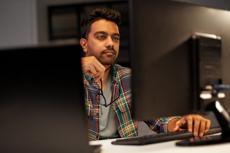 close up of creative man working at night officeの写真素材