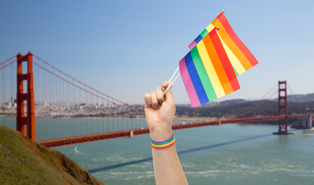 hand with gay pride rainbow flags and wristbandの写真素材