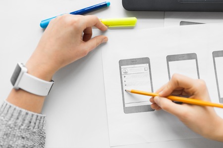 app design, technology and business concept - web designer working on user interface and creating...