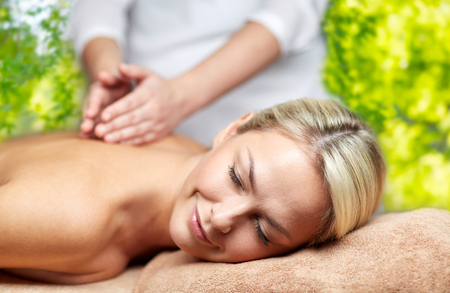 woman having back massage in spaの写真素材