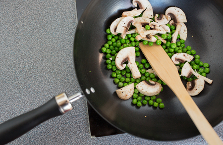 close up of food in frypan on cooking panelの写真素材