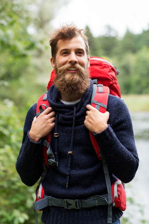 bearded traveler with backpack in woodsの写真素材