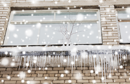 icicles on building or living house facadeの写真素材