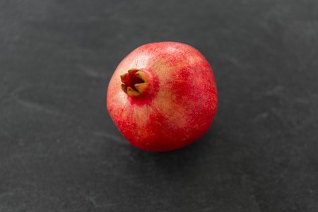 Close up of pomegranate on stone tableの写真素材
