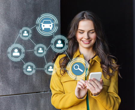 teenage girl using car sharing app on smartphone