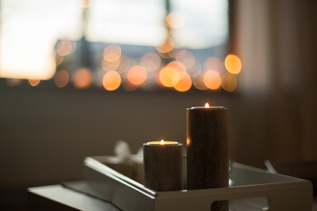 close up of candles on table at homeの写真素材