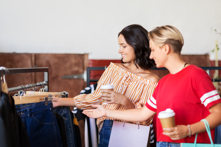 women choosing clothes at vintage clothing storeの写真素材