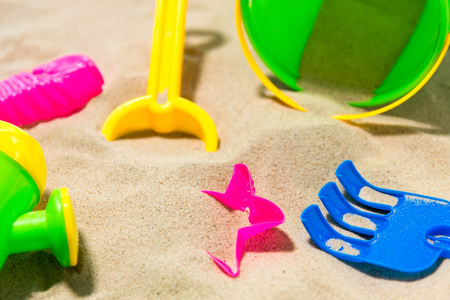 close up of sand toys kit on summer beachの写真素材